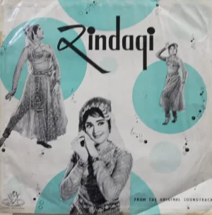 Zindagi - 3AEX 5033 - (Condition 80-85%) - Angel First Pressing - Bollywood Rare LP Vinyl Record Zindagi (transl. Life) is a 1964 Indian Hindi-language film produced by S. S. Vasan, Gemini Pictures and directed by Ramanand Sagar. The film stars Rajendra Kumar, Vyjayanthimala, Raaj Kumar, Prithviraj Kapoor, Mehmood, Jayant, Jeevan, Leela Chitnis and Helen. Record Details Title Zindagi - 3AEX 5033 Star Cast Rajendra Kumar Tuli, Raaj Kumar, Vyjayanthimala, Prithviraj Kapoor, Nirupa Roy, Mehmood, Jeevan Dhar, Kanhaiyalal Chaturvedi, Jayant, Dhumal & Hiralal Director Ramanand Sagar Producer Gemini Pictures Singer Lata Mangeshkar, Asha Bhosle, Mohd. Rafi & Manna Dey Music Shankar Jaikishan Lyrics Hasrat Jaipuri & Shailendra Album Releasing Year 1964 Manufacturing 1964 Genre Original Soundtrack Language Hindi Label Angel First Pressing Made In India Manufacture The Gramophone Company Of India Limited Serial No 3AEX 5033 Side One · Dil Ka Kanwal Lata Mangeshkar & Party · Ghungharwa Mora Asha Bhosle & Mohd. Rafi · Pahle Mile The Mohd. Rafi · Hum Pyar Ka Sauda – Part 1 & 2 Lata Mangeshkar Side Two · Chhoone Na Doongi Lata Mangeshkar & Asha Bhosle · Ek Naye Mehman Lata Mangeshkar · Humne Jafa Na Seekhi Mohd. Rafi · Muskura Ladle Manna Dey · Pyar Ki Dulhan Lata Mangeshkar Specification Size 12 Inches Speed 33 RPM Record Condition 80-85% Cover Condition Excellent Zindagi - 3AEX 5033 - (Condition 80-85%) - Angel First Pressing - Bollywood Rare LP Vinyl Record